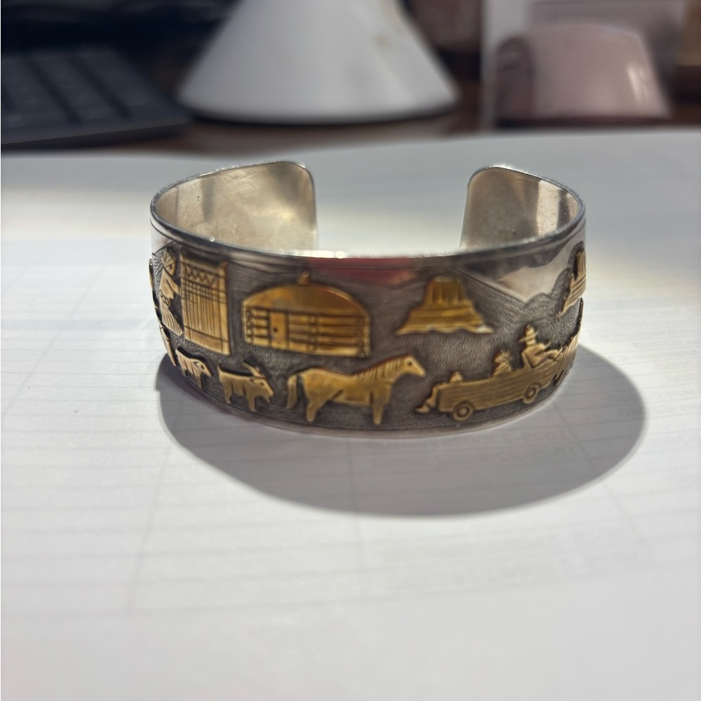 Jacob Kane storytelling pictograph gold and silver cuff.